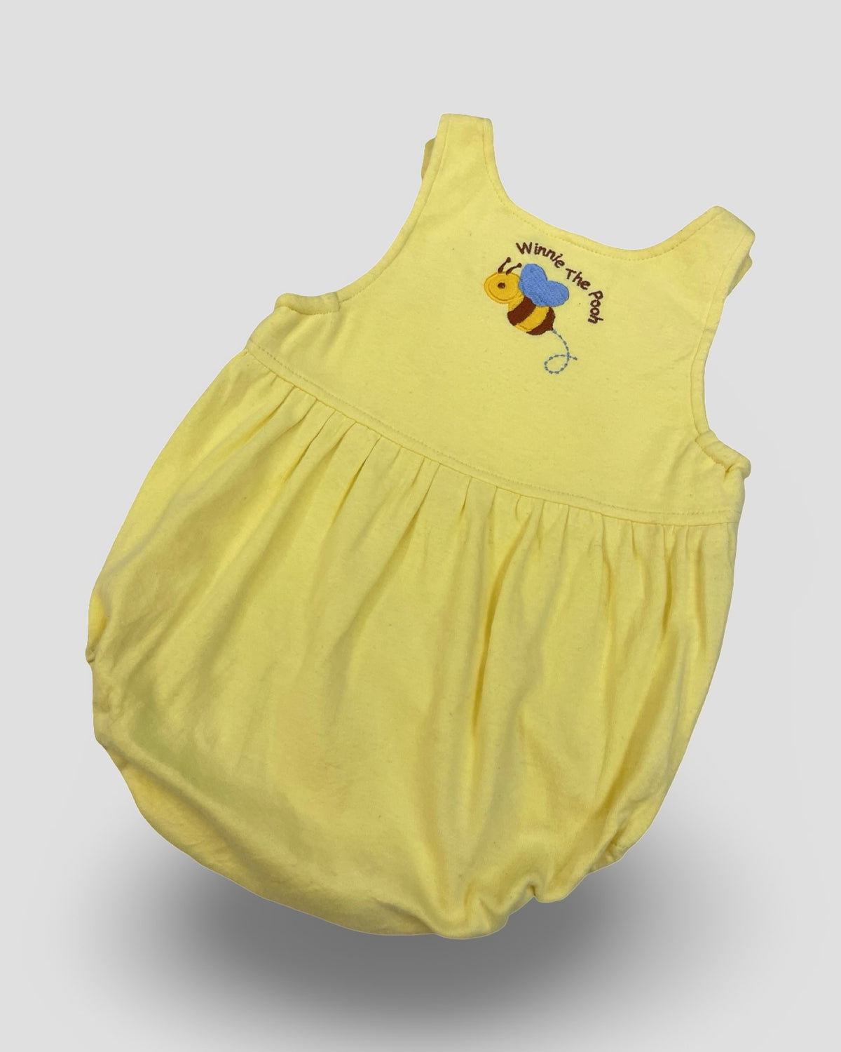 Disney classic winnie the pooh sleeveless yellow bubble romper
