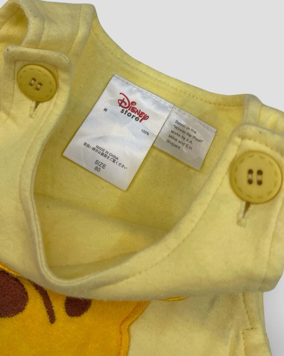 Disney classic winnie the pooh sleeveless yellow bubble romper