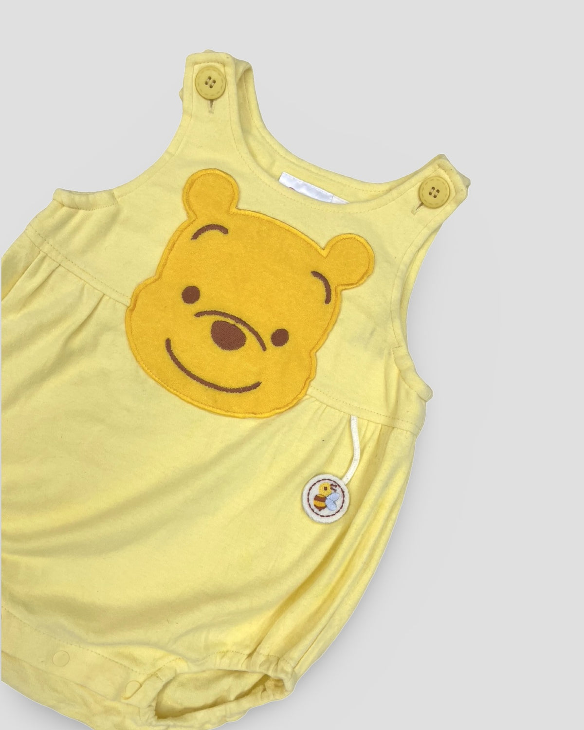Disney classic winnie the pooh sleeveless yellow bubble romper
