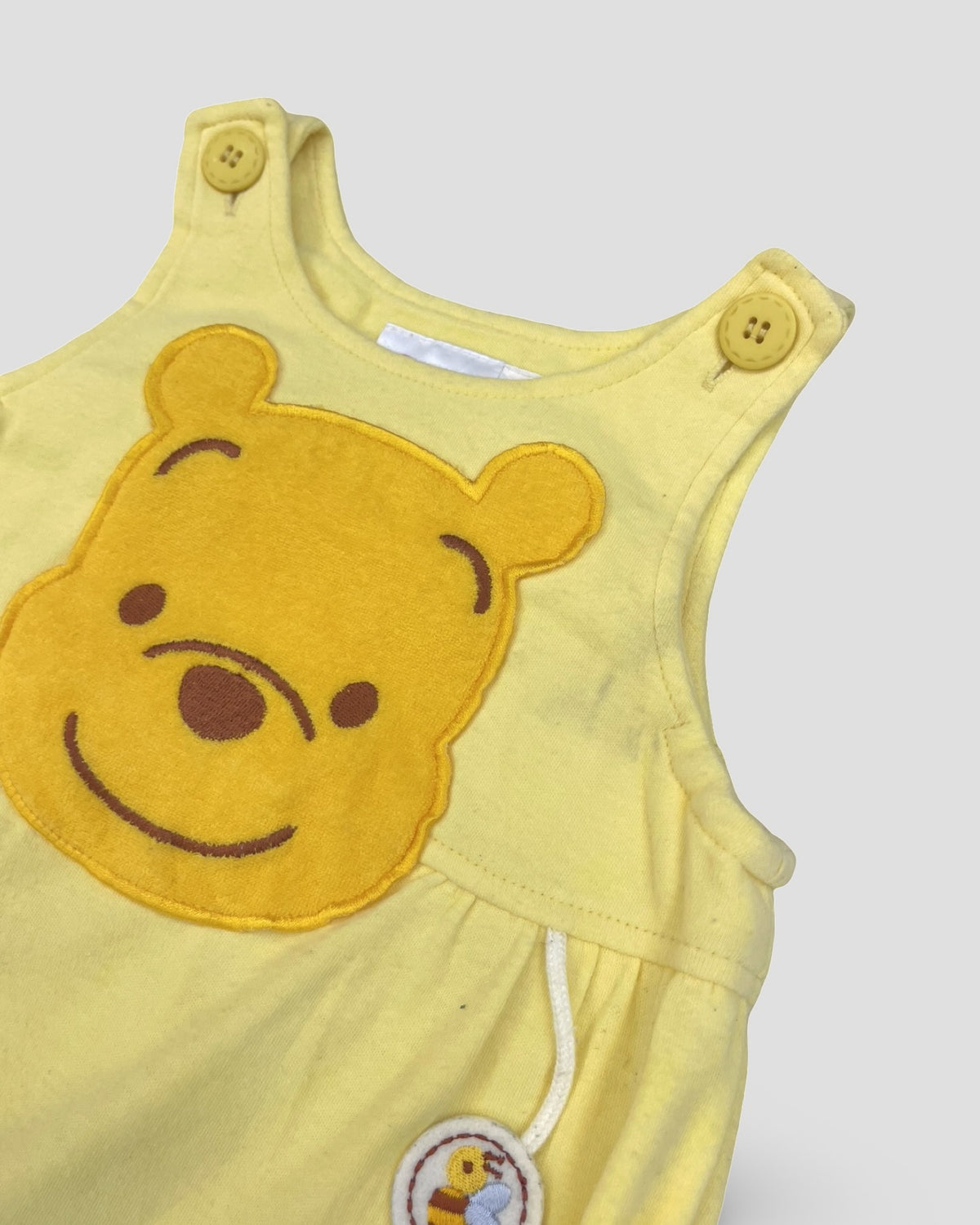 Disney classic winnie the pooh sleeveless yellow bubble romper
