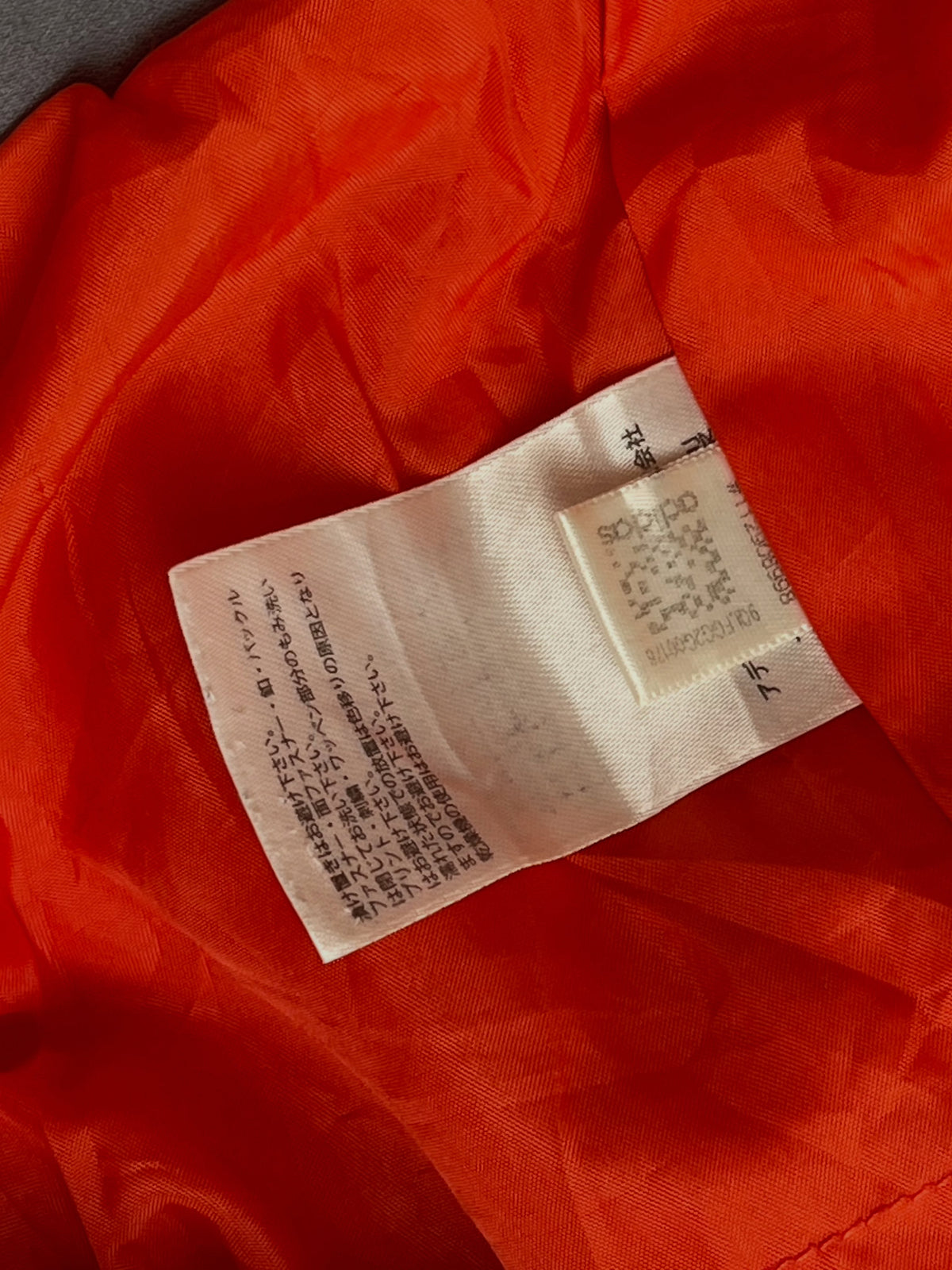 Orange lightweight hooded windbreaker