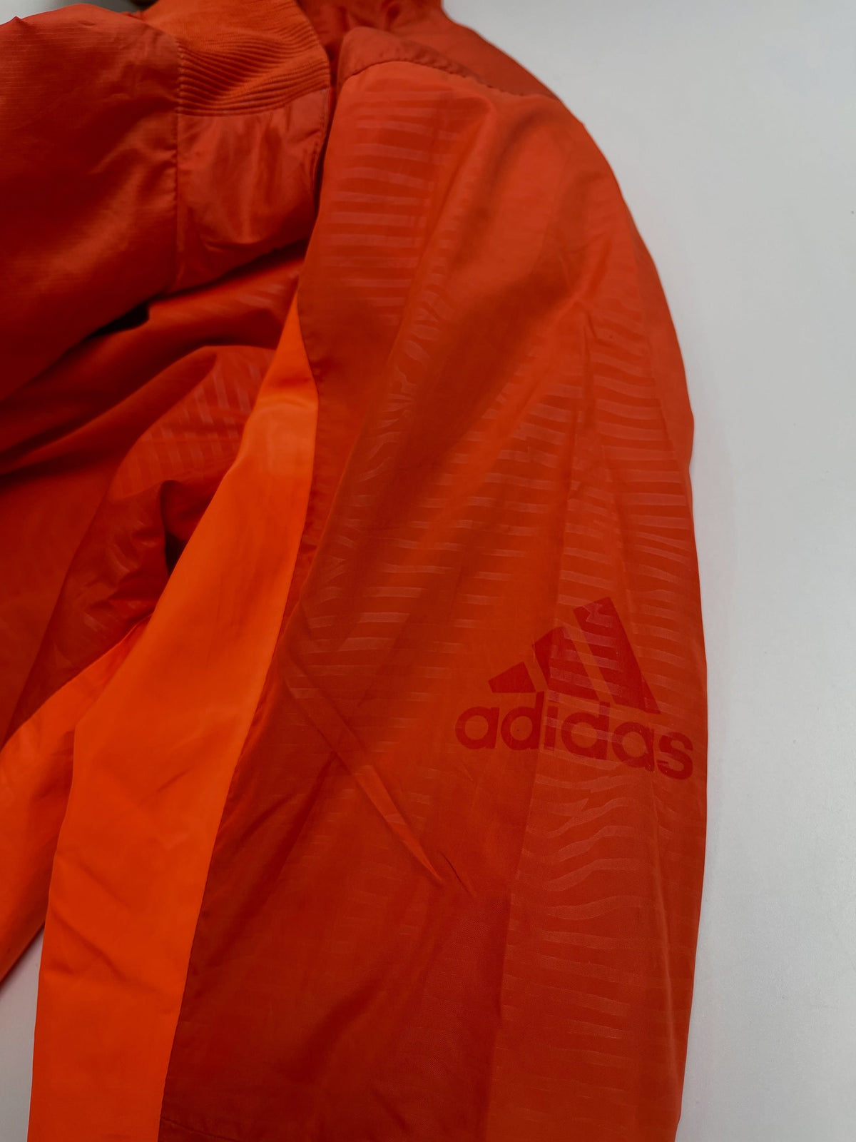 Orange lightweight hooded windbreaker
