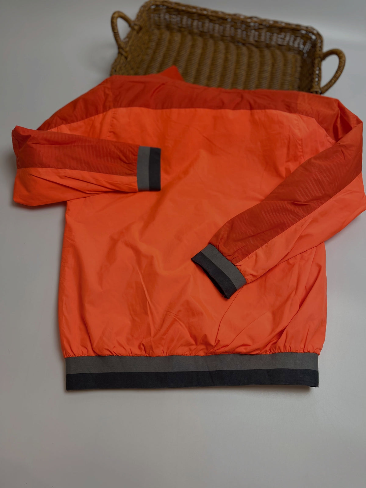 Orange lightweight hooded windbreaker