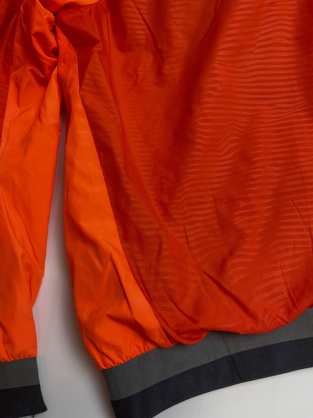 Orange lightweight hooded windbreaker