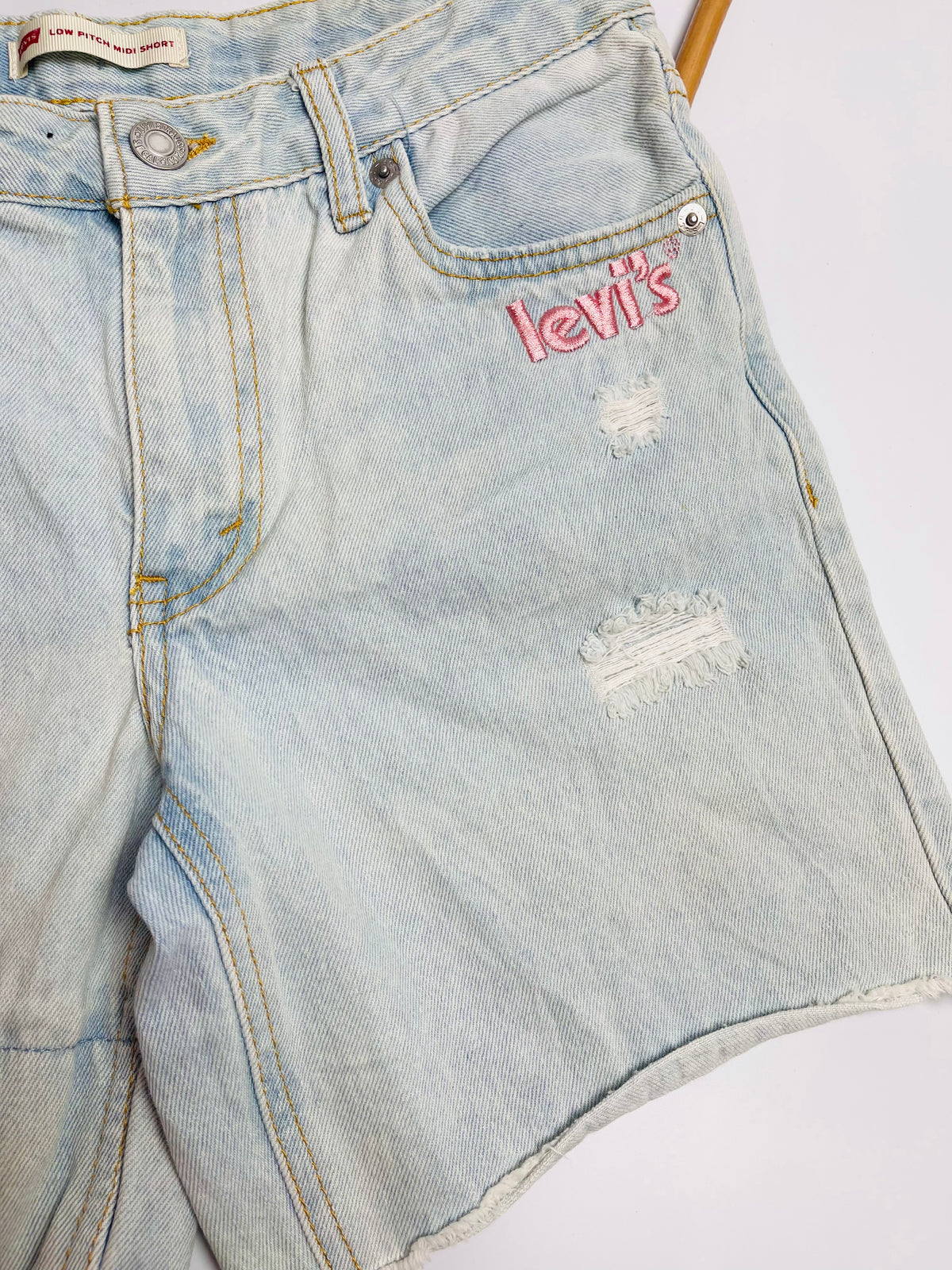 Levi’s Light Wash Distressed Denim Shorts